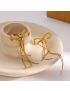 Graceful Gold Bow Drop Earrings